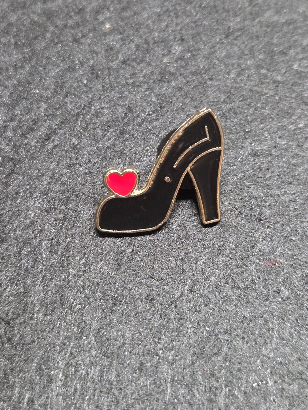 **Black High Heel Enamel Pin with Red Heart Accent**